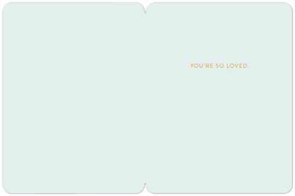 Inside of a new baby card, light blue, with the message 'YOU'RE SO LOVED.' in gold text.
