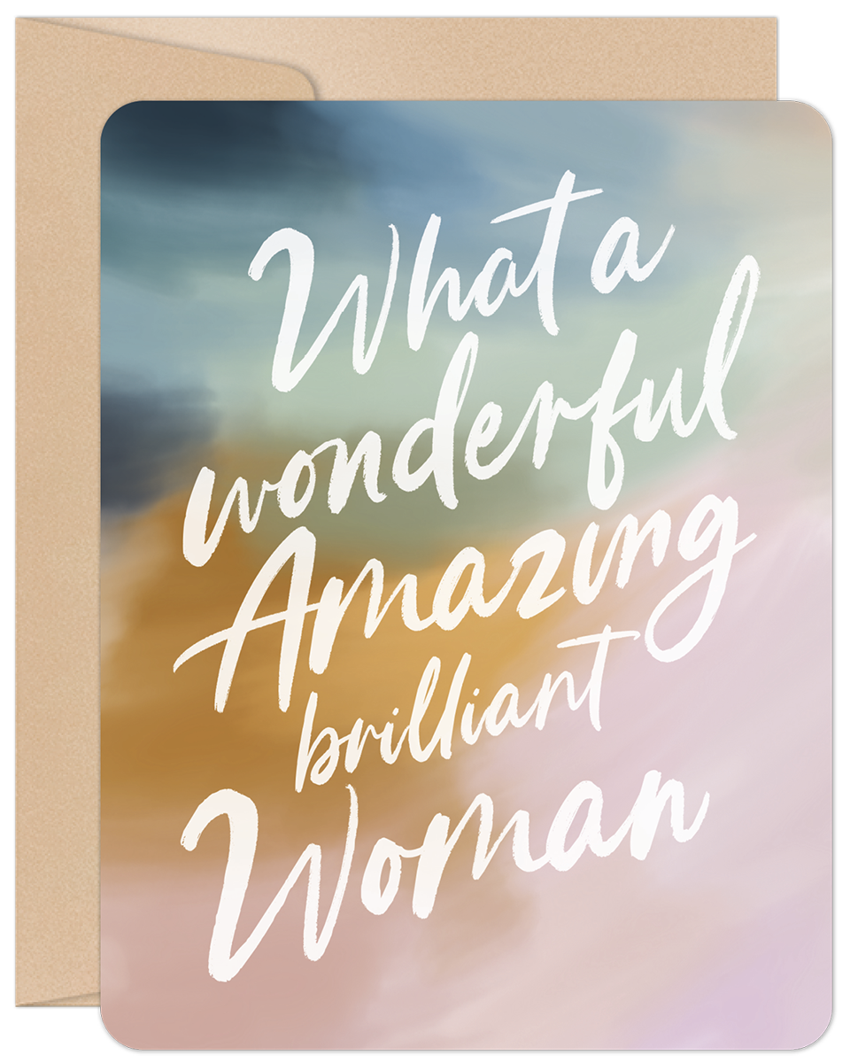Front of a greeting card with 'What a wonderful Amazing brilliant Woman' in white calligraphy over a pastel watercolor background of blue, gold, and pink.