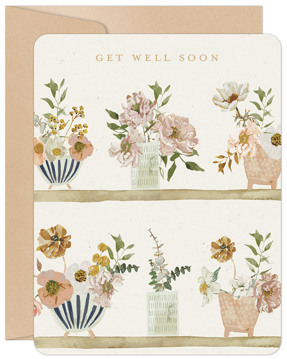 Get Well Soon card featuring watercolor floral arrangements in various vases on two rustic shelves, with a soft peach envelope.