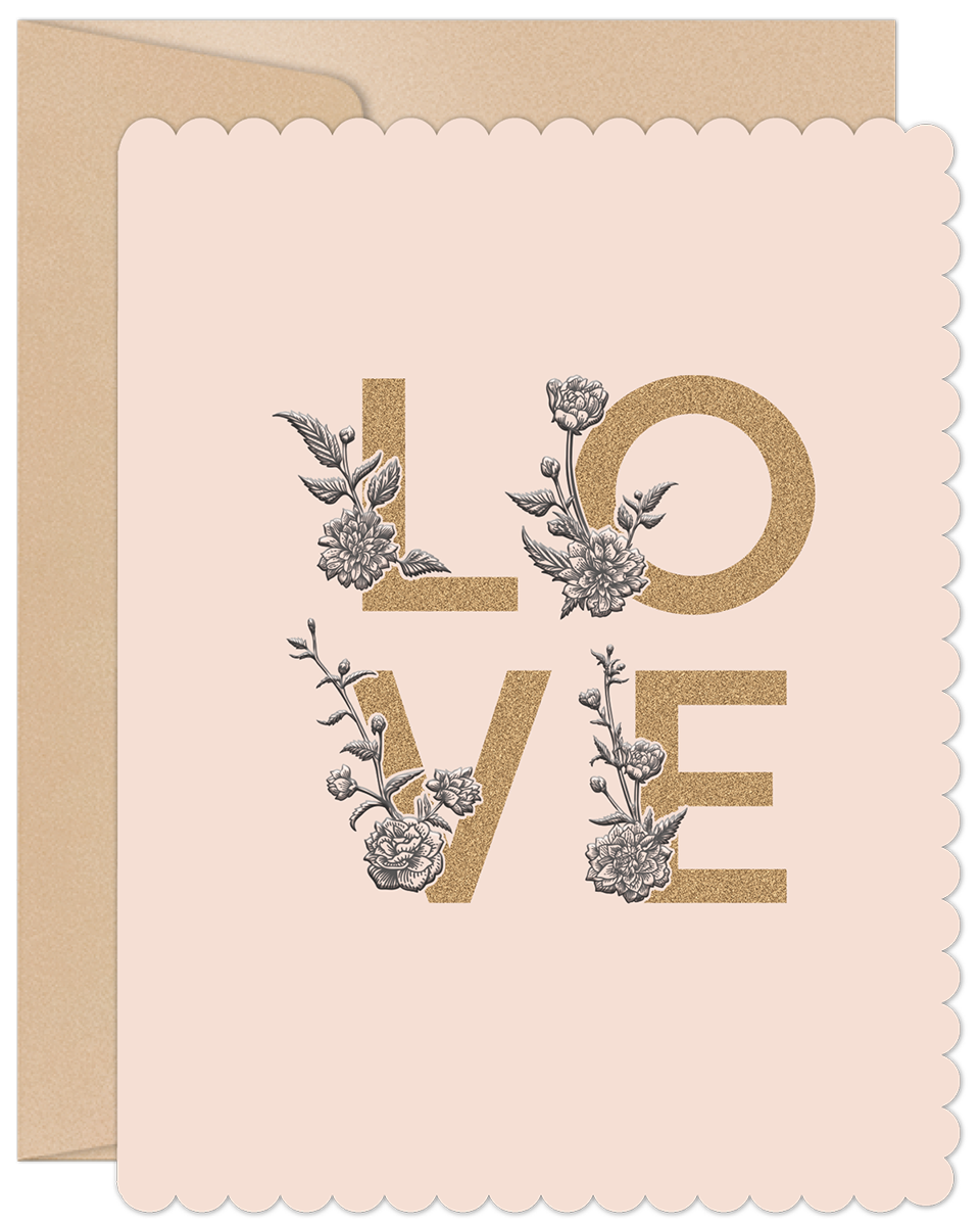 Close-up of a light pink scalloped greeting card with 'LOVE' in gold glitter texture, adorned with intricate black and white floral illustrations. A kraft envelope is visible behind.
