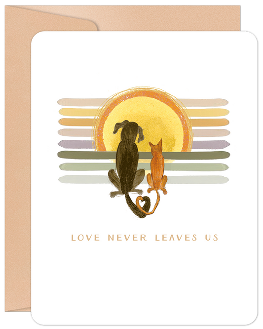 Pet sympathy card with a dog and cat watching a colorful sunset, text reads 'Love Never Leaves Us'.