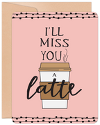 Front of a funny 'I'll Miss You A Latte' greeting card with a coffee cup design on a light pink background, bordered by black polka dots, accompanied by a kraft envelope.