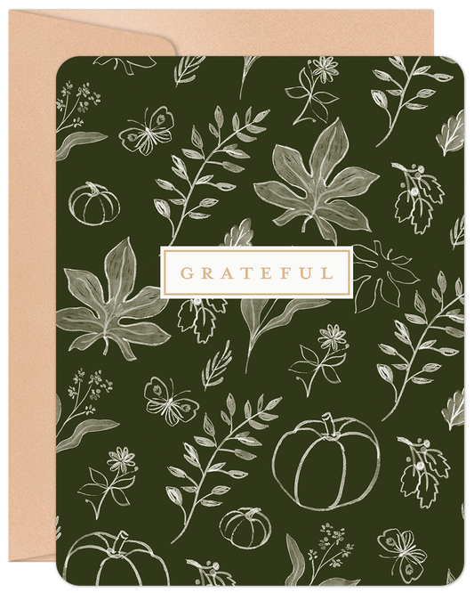 Front of Grateful Thanksgiving card with dark green background, white fall foliage, pumpkins, butterflies, and 'GRATEFUL' text.