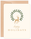 Elegant holiday greeting card featuring a golden reindeer silhouette within a delicate green leaf wreath, centered on a cream background with 'happy HOLIDAYS' text. Perfect for season's greetings.