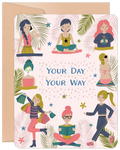 Front of a vibrant women's self-care greeting card, featuring diverse women enjoying activities like yoga, reading, shopping, spa treatment, and exercise amidst tropical leaves. Text: 'YOUR DAY YOUR WAY'.