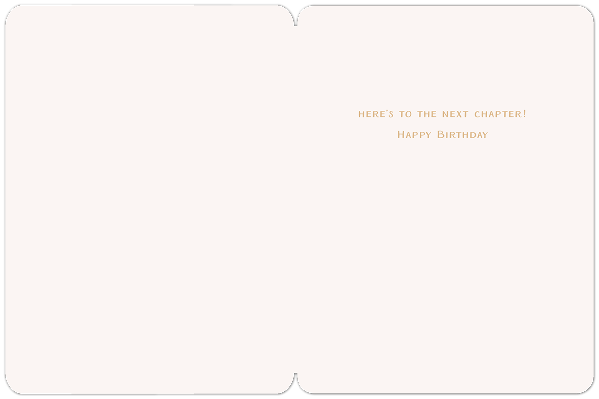 Inside of a cream-colored greeting card displaying the elegant gold text: "HERE'S TO THE NEXT CHAPTER! HAPPY BIRTHDAY" in the center.