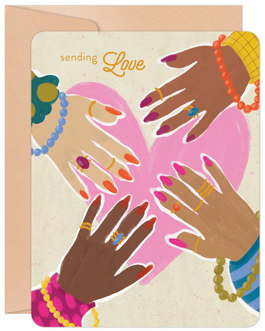 Front of an encouragement card showing four diverse women's hands with colorful jewelry and nail polish forming a heart with text 'sending Love'.