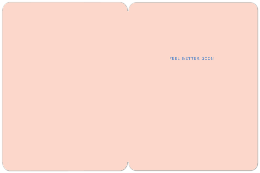 Inside of a 'feel better soon' greeting card with a soft pink background and simple blue text.