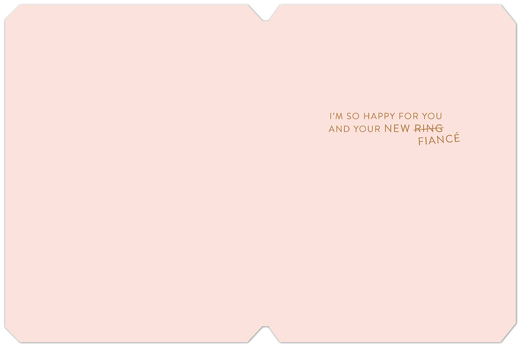 Inside view of a heartfelt engagement card, displaying 'I'M SO HAPPY FOR YOU AND YOUR NEW RING FIANCÉ' in elegant gold script on a light pink background.