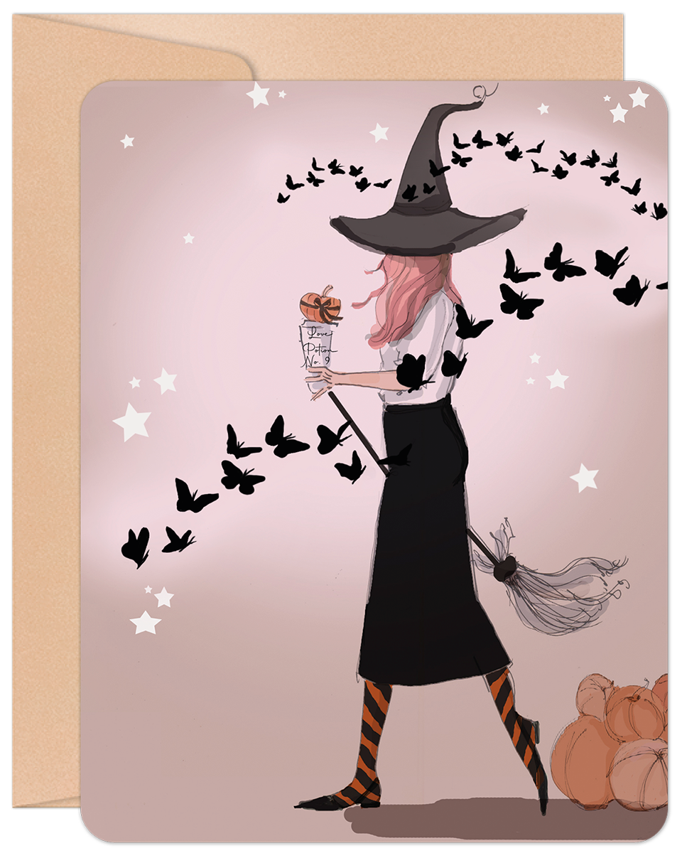 Front of a stylish Halloween greeting card featuring a modern witch with pink hair, a broom, and whimsical butterflies on a light pink background.