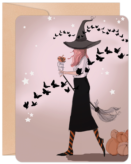 Front of a stylish Halloween greeting card featuring a modern witch with pink hair, a broom, and whimsical butterflies on a light pink background.