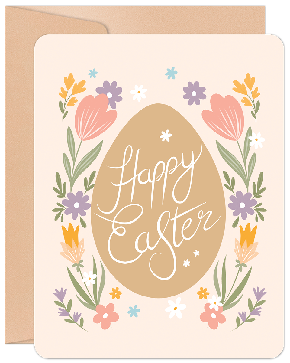 Front of a Happy Easter greeting card featuring a large brown egg with 'Happy Easter' in white script, surrounded by colorful spring flowers on a light pink background.