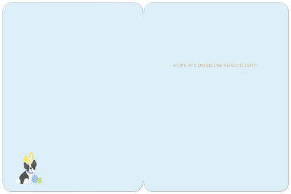 Inside of a light blue greeting card with a cute dog and colorful eggs, featuring the punny message 'HOPE IT'S DOGGONE EGG-CELLENT!'