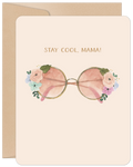 Watercolor Mother's Day greeting card featuring stylish pink sunglasses adorned with pastel floral bouquets on a light peach background, with gold text 'STAY COOL, MAMA!' and a kraft envelope.