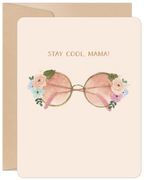 Watercolor Mother's Day greeting card featuring stylish pink sunglasses adorned with pastel floral bouquets on a light peach background, with gold text 'STAY COOL, MAMA!' and a kraft envelope.