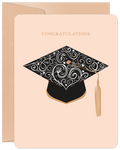 Elegant cream-colored greeting card featuring a black ornate academic cap with a gold tassel, and 'Congratulations' text, ideal for celebrating academic achievement and success.