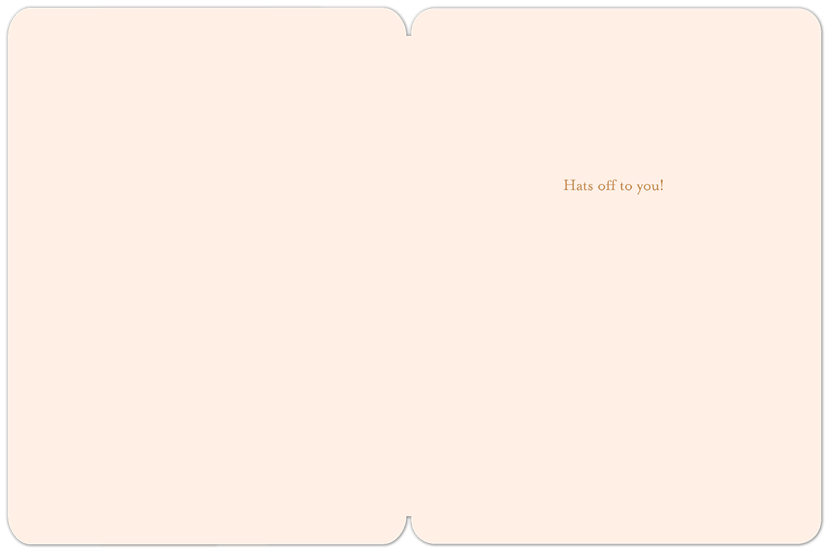 Inside of a light pink graduation card with the message 'Hats off to you!' in elegant gold script on the right side.