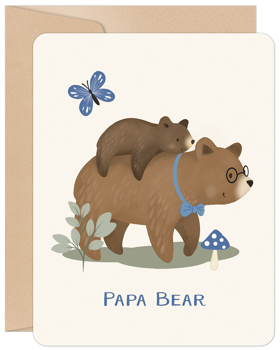 Cute Father's Day greeting card featuring a loving papa bear wearing glasses and a blue bow tie, carrying his small cub on his back. A blue butterfly, green plant, and blue mushroom add to the charming woodland scene. 'PAPA BEAR' text is visible at the bottom. The card is presented with a rustic kraft envelope.