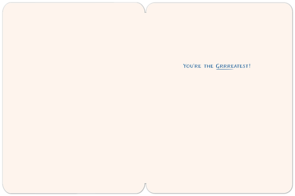 Inside view of a cream-colored Father's Day greeting card, showing a clean, spacious area with the message 'YOU'RE THE GRRREATEST!' written in blue text on the top right corner, perfect for a personalized message.
