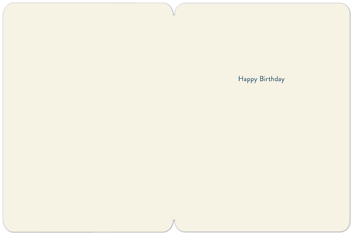 Inside of a lighthearted birthday card showing a cream-colored interior with the simple blue text 'Happy Birthday'.