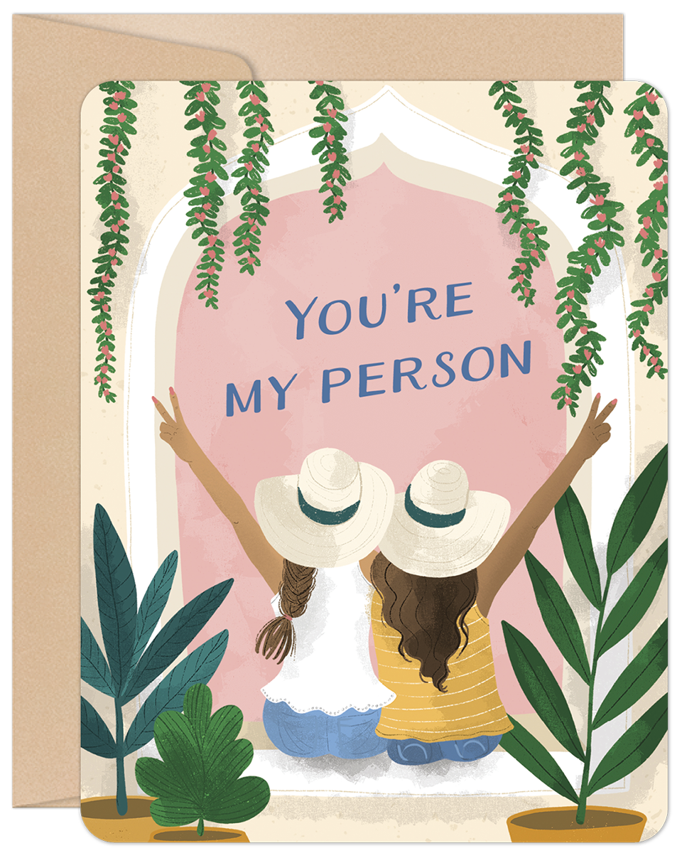 Heartfelt greeting card for her featuring two women wearing sun hats looking out a window with foliage, and the message 'YOU'RE MY PERSON' in blue text. Perfect for celebrating special bonds.