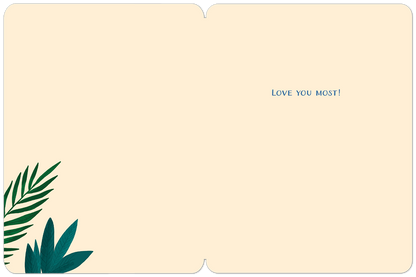 Inside of a greeting card with a simple border, green botanical accents, and the blue text "LOVE YOU MOST!" centered.