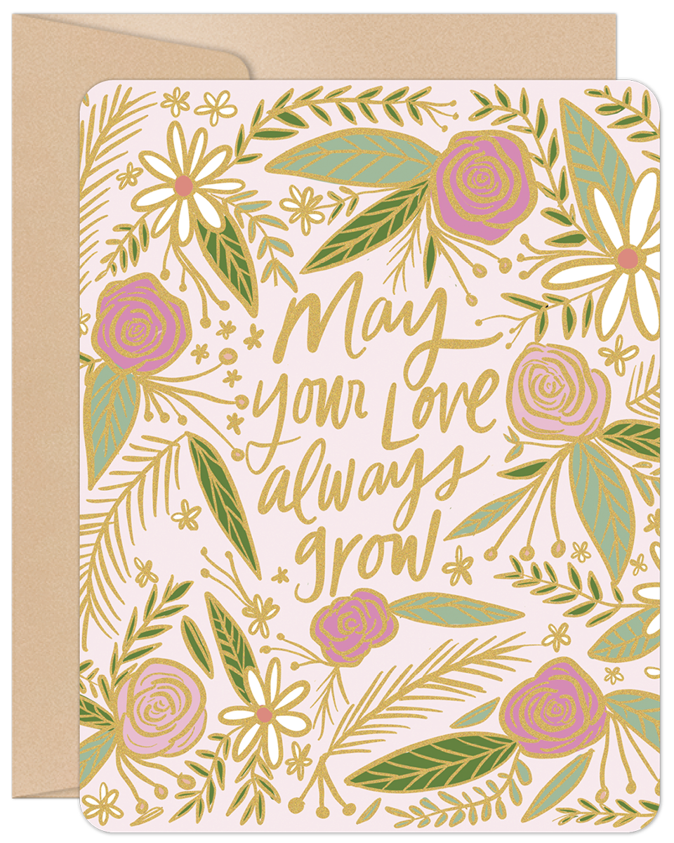 Front of a pink anniversary card with gold foil and green floral design, featuring "May your love always grow" text.