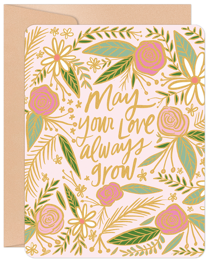 Front of a pink anniversary card with gold foil and green floral design, featuring "May your love always grow" text.