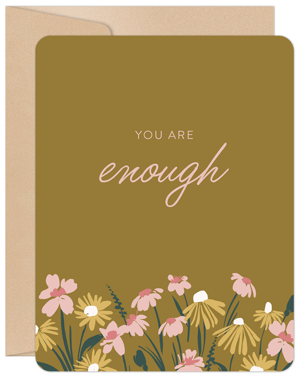Front of 'You Are Enough' greeting card with mustard background, pink and yellow flowers, and 'you are enough' in script.