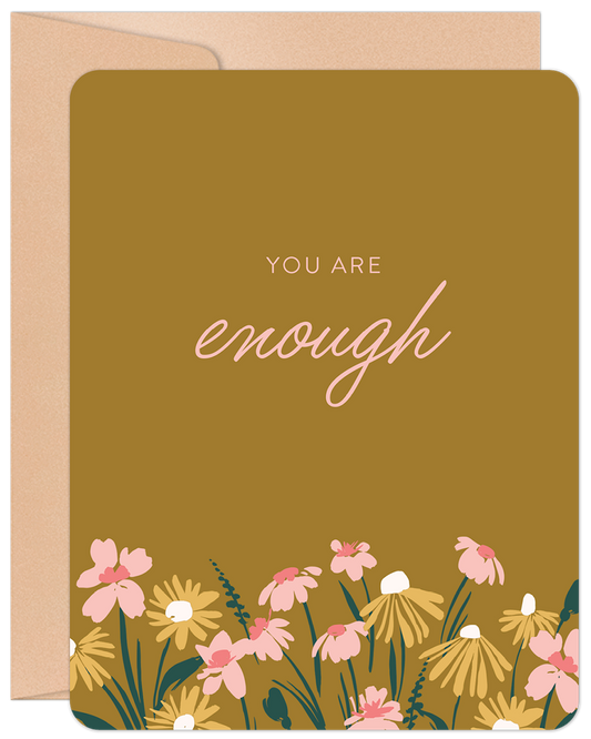 Front of 'You Are Enough' greeting card with mustard background, pink and yellow flowers, and 'you are enough' in script.
