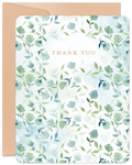 Elegant thank you greeting card with watercolor green and blue floral design on a white background, accompanied by a kraft brown envelope.