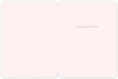 Inside of a Valentine's Day greeting card showing the heartfelt message 'I'm so glad you're mine.' in elegant script.