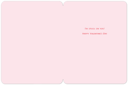 Inside of the Valentine's Day greeting card with a simple pink background and the red text 'I'M STUCK ON YOU! HAPPY VALENTINE'S DAY'.