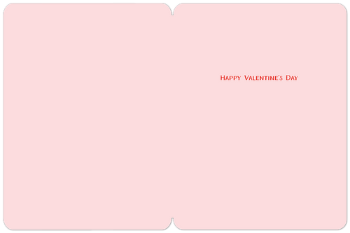 Interior of a pink Valentine's Day card with the simple message 'HAPPY VALENTINE'S DAY' in red text, ready for a personalized note.
