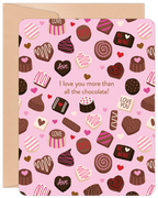 A romantic greeting card featuring a pink background covered with various brown and pink chocolates, hearts, and candy. Text reads "I love you more than all the chocolate!" with words like "LOVE," "KISS," "BE MINE," and "LOVE YOU" on some chocolates. The card is suitable for Valentine's Day or other romantic occasions.