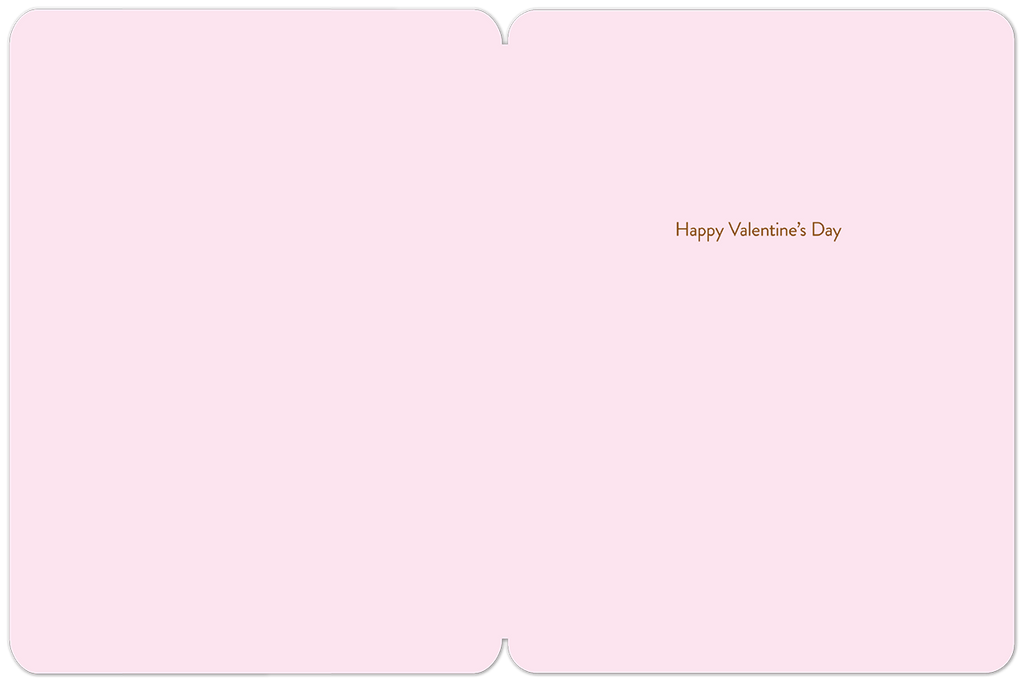 The inside of a romantic pink greeting card, blank on the left side and with small brown text "Happy Valentine's Day" on the right, providing ample space for a personal, handwritten message to a spouse or loved one.
