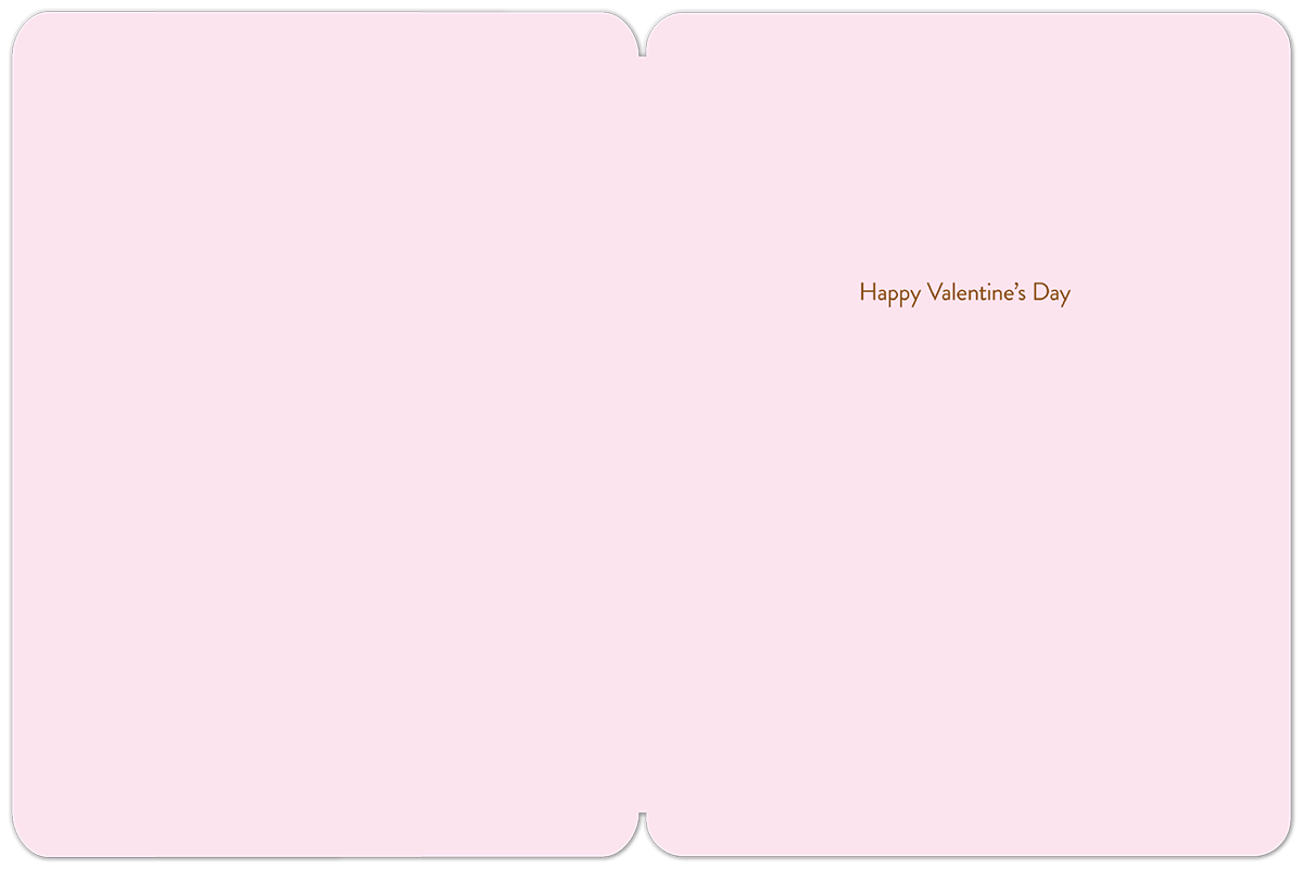 The inside of a romantic pink greeting card, blank on the left side and with small brown text "Happy Valentine's Day" on the right, providing ample space for a personal, handwritten message to a spouse or loved one.