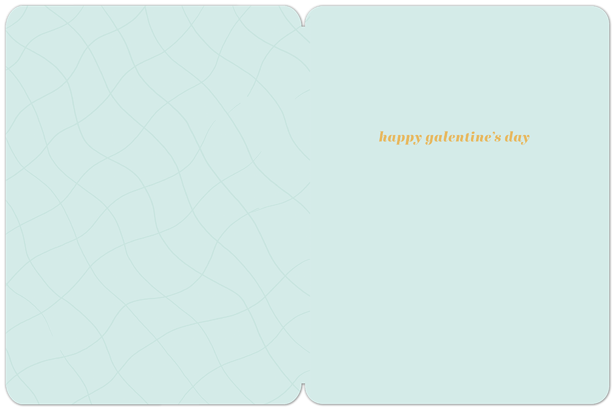Inside view of a light blue Galentine's Day greeting card with subtle wavy lines, showing the message "happy galentine's day" on the right.