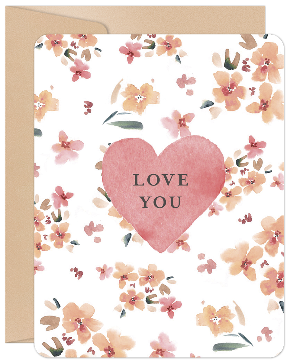 Front view of a romantic watercolor greeting card featuring a large pink heart with 'LOVE YOU' text, surrounded by soft peach and pink floral blossoms. A kraft paper envelope is visible behind the card.