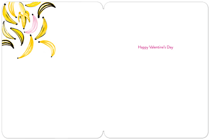 Inside of a white Valentine's Day greeting card with 'Happy Valentine's Day' in pink text and banana art in the top left.