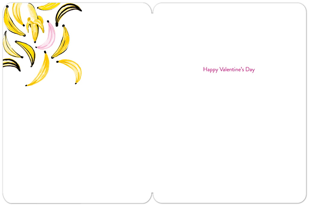 Open greeting card with a clean white interior. The upper left corner features a charming cluster of yellow and pink banana illustrations. In the bottom right quadrant, subtle pink text reads "Happy Valentine's Day".