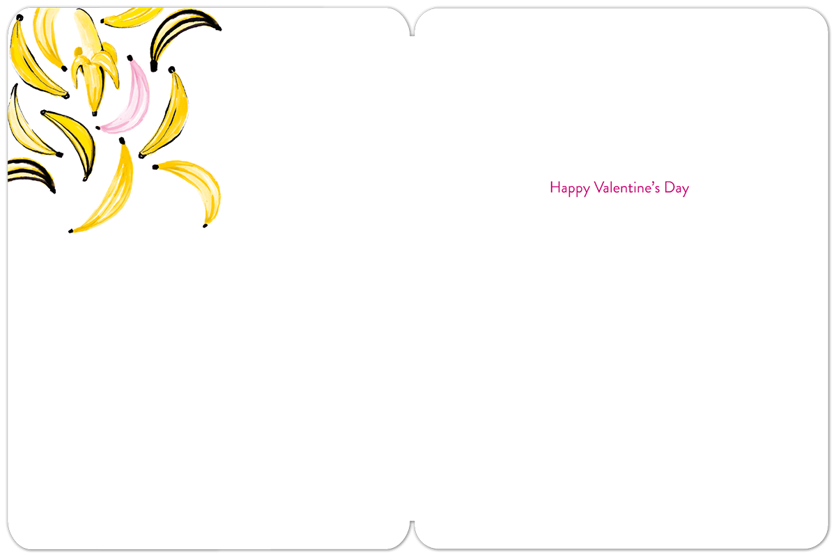 Open greeting card with a clean white interior. The upper left corner features a charming cluster of yellow and pink banana illustrations. In the bottom right quadrant, subtle pink text reads "Happy Valentine's Day".