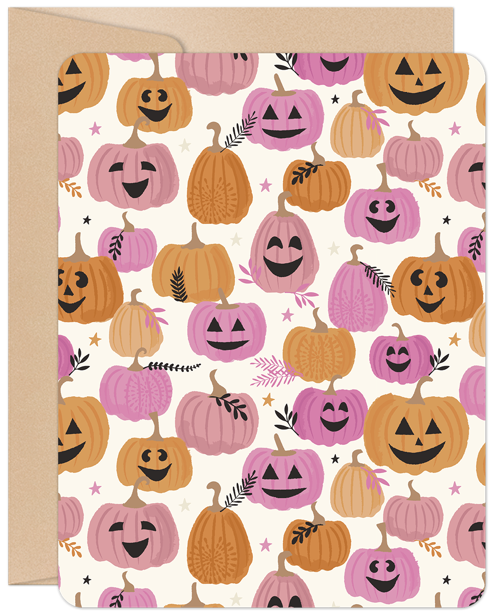 Front of a cute Halloween greeting card featuring a pattern of smiling pink and orange pumpkins with small leaves and stars.