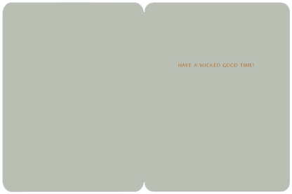 Inside of a light grey Halloween greeting card with the message 'HAVE A WICKED GOOD TIME!' in orange text.