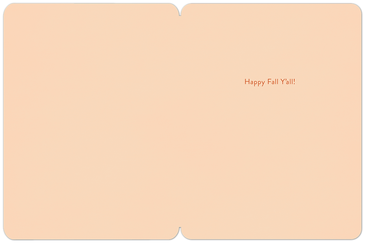 Inside of a light peach fall greeting card with the cheerful message 'Happy Fall Y'all!' in orange cursive font.