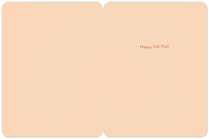 Inside of a light peach fall greeting card with the cheerful message 'Happy Fall Y'all!' in orange cursive font.