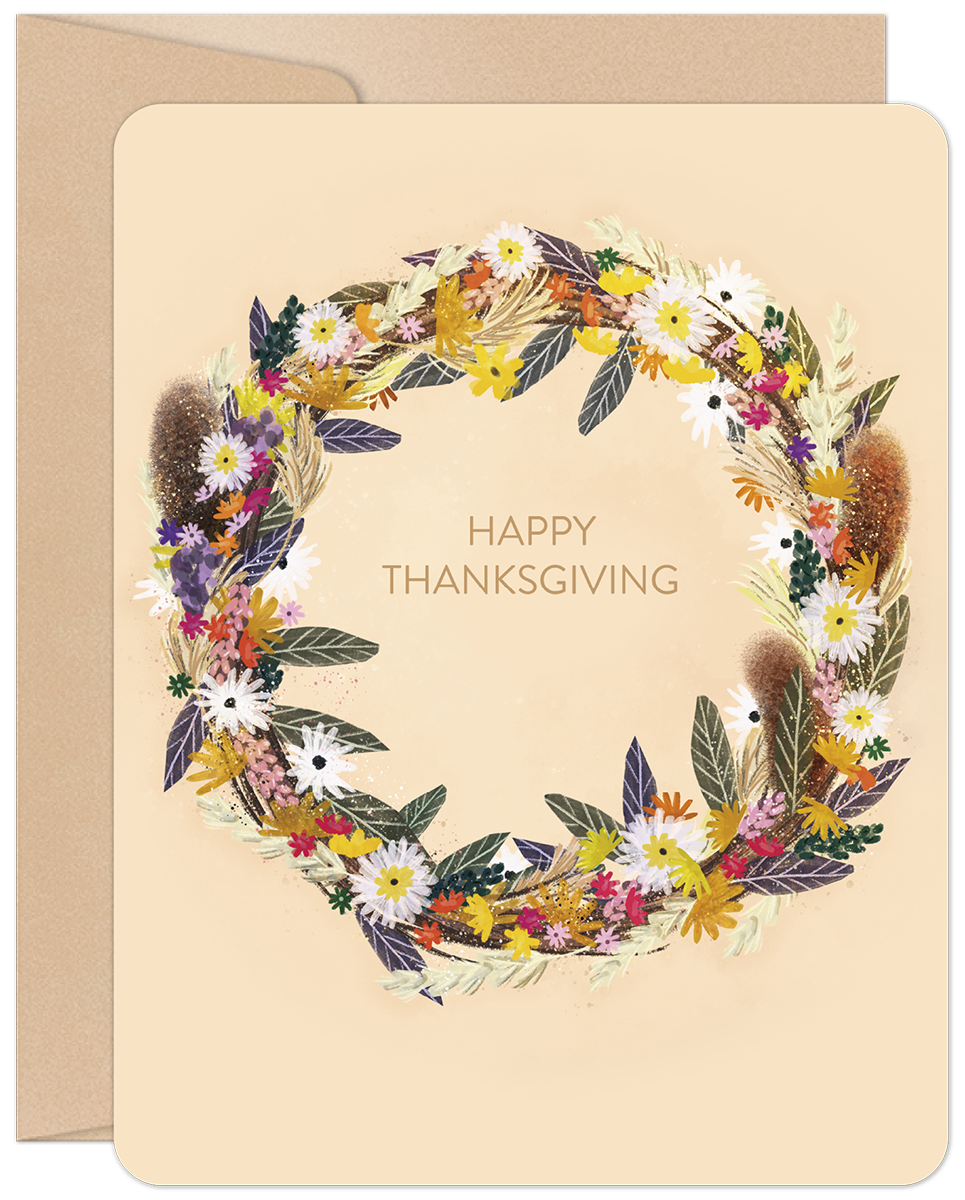 Front of a Happy Thanksgiving greeting card featuring a vibrant, artistic harvest wreath with colorful autumn flowers and foliage.