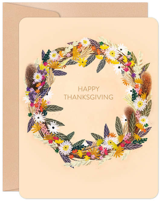 Front of a Happy Thanksgiving greeting card featuring a vibrant, artistic harvest wreath with colorful autumn flowers and foliage.