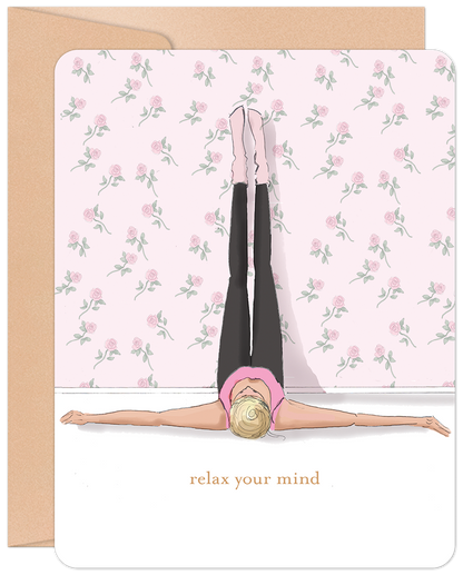 Front of 'Relax Your Mind' greeting card with a woman in a legs-up-the-wall yoga pose against a pink rose wallpaper. Text 'relax your mind'.