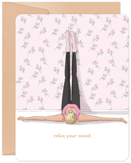 Front of 'Relax Your Mind' greeting card with a woman in a legs-up-the-wall yoga pose against a pink rose wallpaper. Text 'relax your mind'.